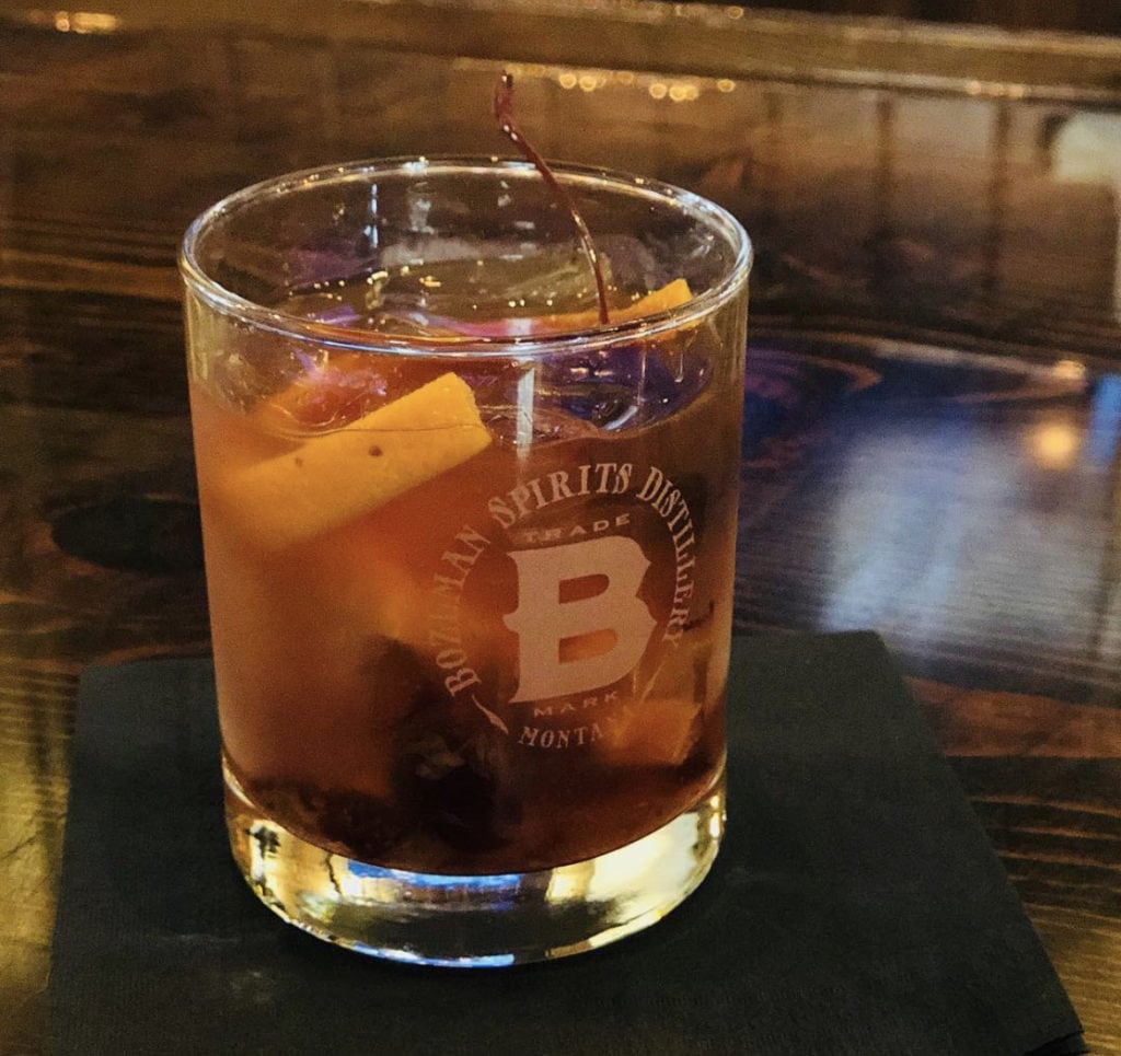 cocktail in lowball glass inside of bozeman spirits distillery