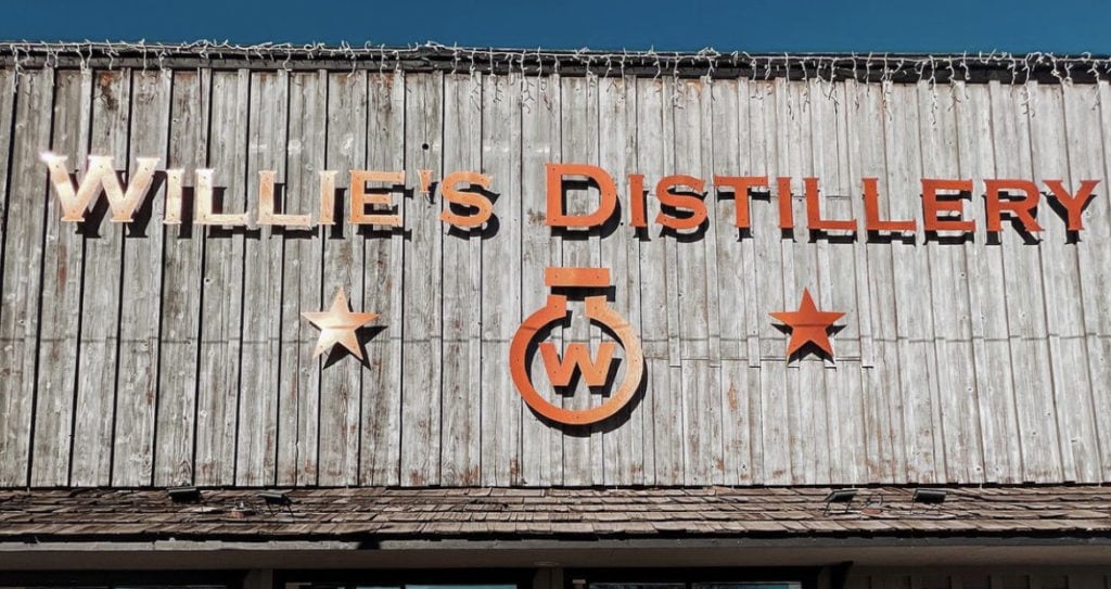 exterior signage of willie's distillery