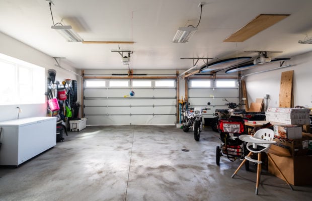 488 Countryside Lane - inside of the 3-car attached garage with polished concrete floors and 2 rolling garage doors with windows. there is also a window along the left wall