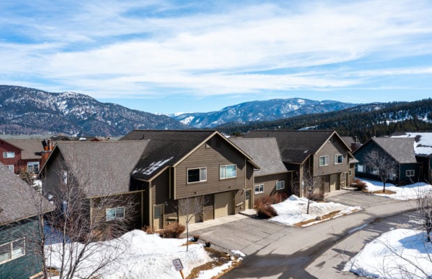 79 Starlight Drive - drone photo of front exterior of condo building with mountains in the background