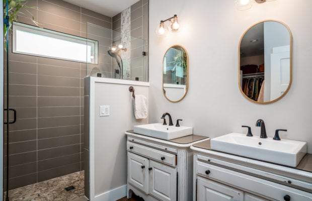 488 Countryside Lane - primary bathroom with 2 sink vanities on the right and a tiled shower to the left