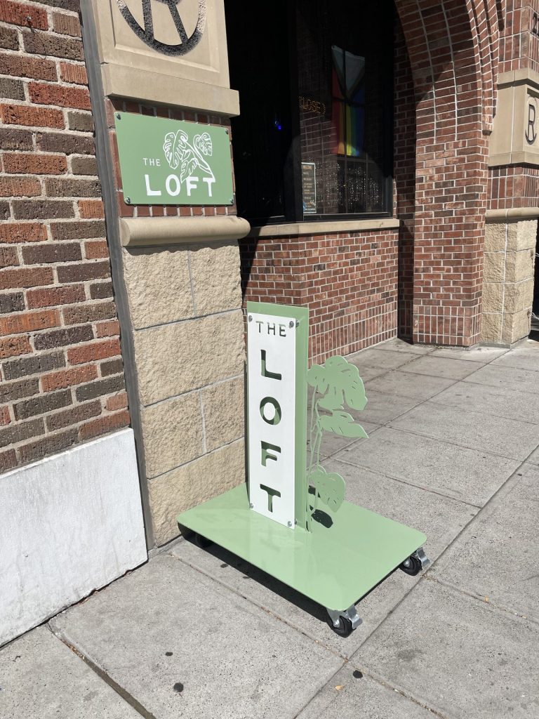 outside of the loft spa building featuring signage