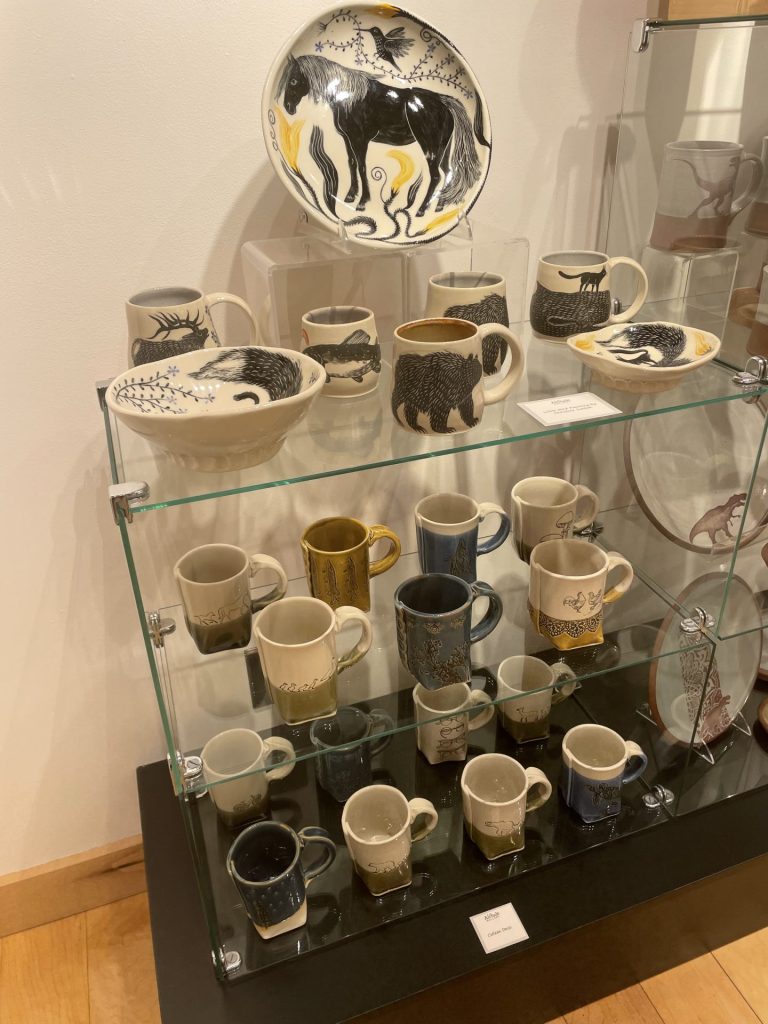 A display of handmade pottery inside of the altitude gallery