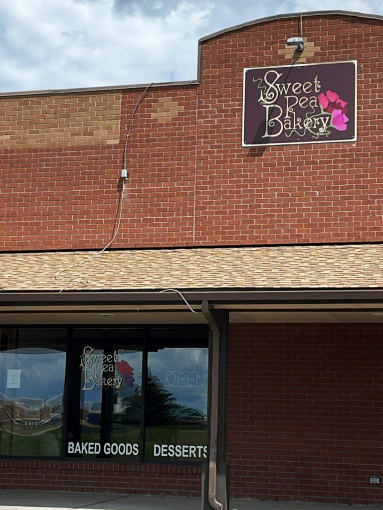 Exterior of the building and signage for Sweet pea bakery