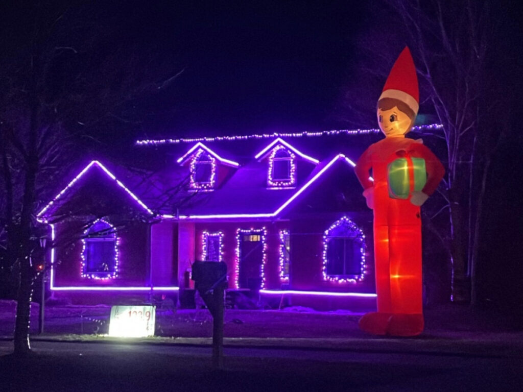 a home at 527 Red Barn Drive in belgrade with a festive outdoor display for the holidays