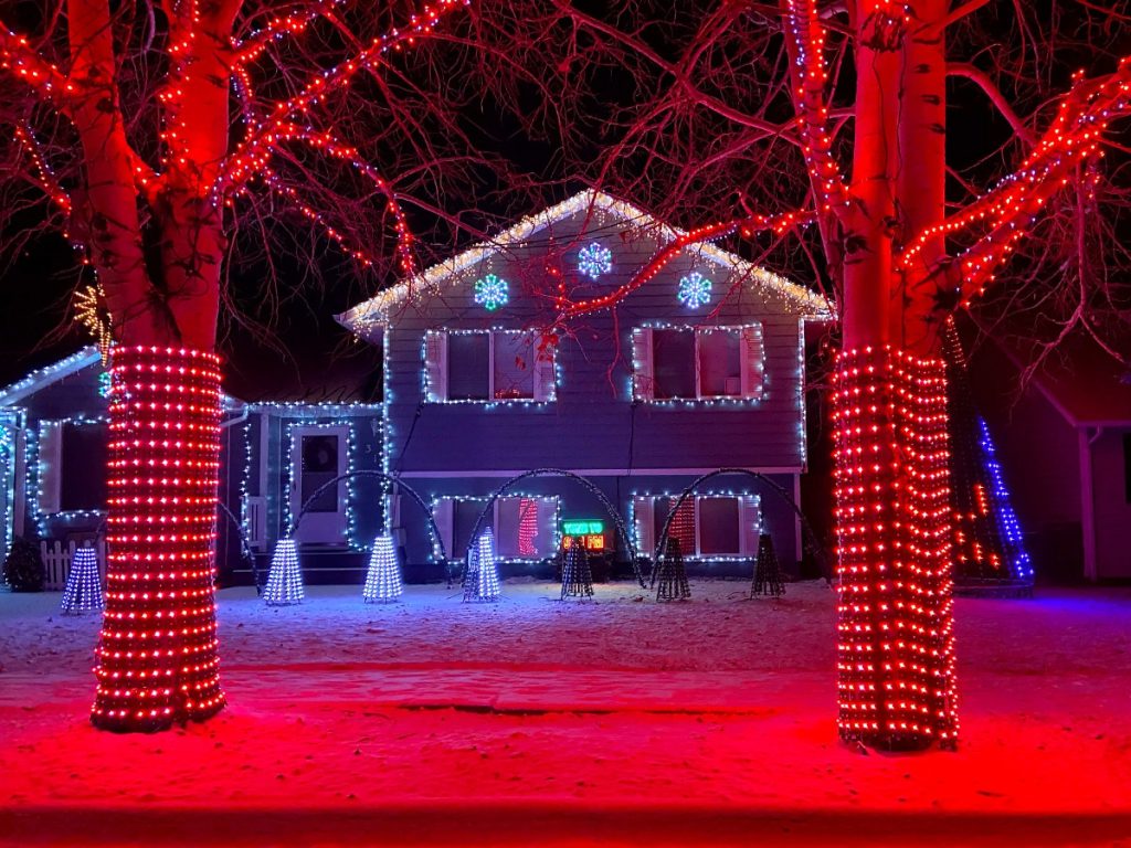 a home at 313 Powder Run Avenue with a festive outdoor display for the holidays