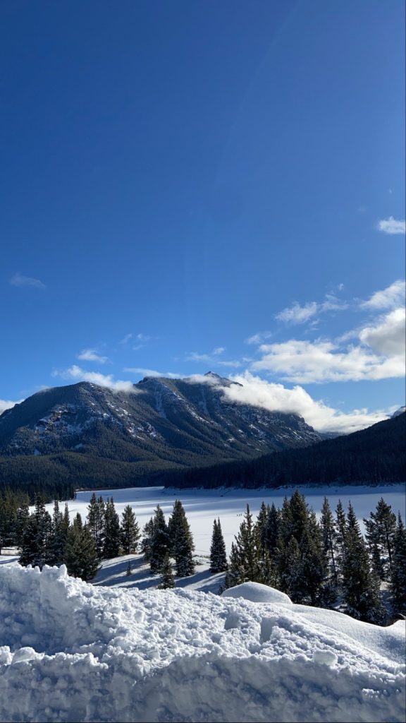 view of ice and snow covered reservoir in hyalite canyon area