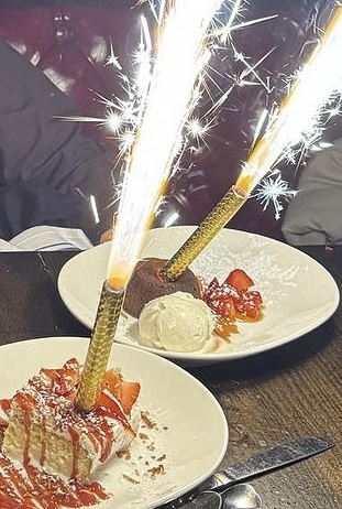 plated desserts with lit sparklers sticking out at j.w. heist restaurant