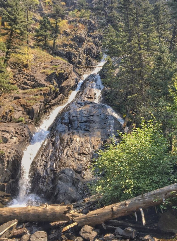 view of pine creek falls from the bottom where the trail is